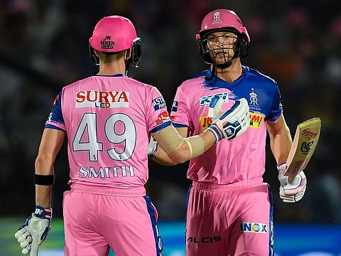 Rajasthan Royals' Jos Buttler (right) is congratulated by his teammate Steve Smith after completing a half-century in IPL 2019.