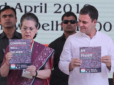 United Progressive Alliance Chairperson Sonia Gandhi, left, and Congress Party President Rahul Gandhi, right, release Congress party's manifesto for the upcoming general elections, in New Delhi, India.