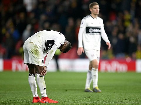 Fulham's Ryan Sessegnon, left, appears dejected after the final whistle.