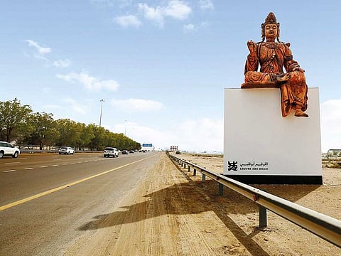A sculpture of Chinese deity Guanyin from Louvre Abu Dhabi greets motorists on the E11 Abu Dhabi-Dubai highway.
