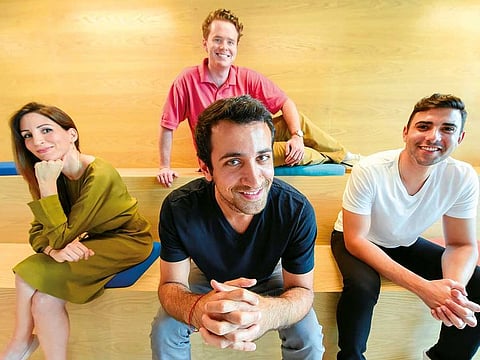 Gordon Robinson, then Left to Right, Nadine Mezher, Mark Chahwan, Co-founder and CEO of Sarwa and Danny Jabbour, in Sarwa office in DIFC, Dubai.