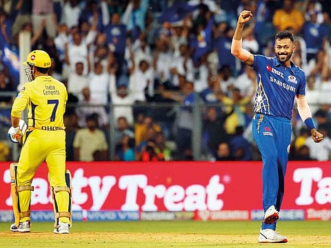 Mumbai Indians Hardik Pandya, right, celebrates the dismissal of Chennai Super Kings Mahendra Singh Dhoni, left, during the VIVO IPL T20 cricket match between Mumbai Indians and Chennai Super Kings in Mumbai, India.