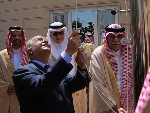 Iraq Foreign Minister Mohamed Alhakim, center left, raises the Saudi flag during the opening ceremony of the Saudi consulate in Baghdad, Iraq, Thursday, April 4, 2019. 