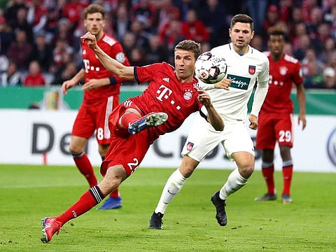 Munich's Thomas Mueller scores his side's equalizing goal during the German Soccer Cup match between FC Bayern Munich and 1. FC Heidenheim in Munich, Germany, Wednesday, April 3, 2019.