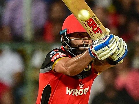 RCB batsman Virat Kohli plays a shot during the Indian Premier League 2019 (IPL T20) cricket match between Royal Challengers Bangalore (RCB) and Kolkata Knight Riders (KKR) at Chinnaswamy Stadium in Bengaluru, Friday, April 5, 2019
