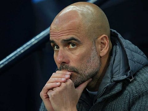 Manchester City's Spanish manager Pep Guardiola reacts during the English Premier League football match between Manchester City and Cardiff City at the Etihad Stadium in Manchester, north west England.