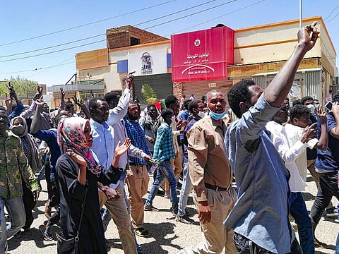 Sudanese protesters chant slogans during an anti-government demonstration in the capital Khartoum on April 6, 2019. 