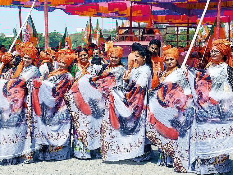 BJP supporters wear saris with PM Narendra Modi