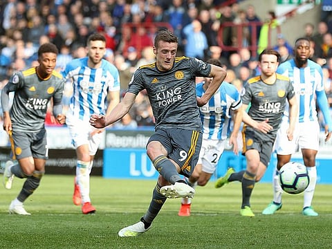 Leicester City's Jamie Vardy scores against Huddersfield Town during the English Premier League soccer match at the John Smith's Stadium, Huddersfield, England, Saturday April 6, 2019. 