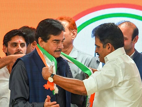 Actor and MP Shatrughan Sinha being welcomed by Congress leader KC Venugopal as he formally joins the party, at AICC headquarters in New Delhi, Saturday, April 6, 2019.