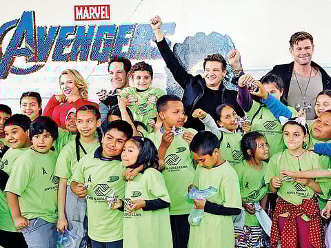 Johansson, Rudd, Renner and Hemsworth interact with kids at an event promoting the Universe Unites Charity.