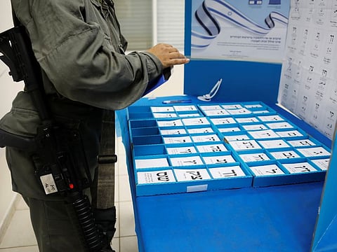 An Israeli border policewoman stands behind a mobile voting booth a day before polling stations open in the rest of Israel, at a base in Beit Horon settlement in the Israeli-occupied West Bank April 8, 2019. 