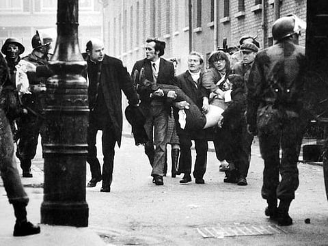 Sinn Fein activist Martin McGuinness with an IRA honour guard at the funeral of IRA terrorist Brendan Burns