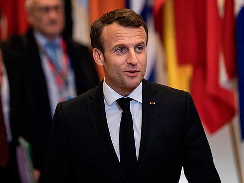 France's President Emmanuel Macron talks to journalists after a European Council meeting on Brexit at The Europa Building at The European Parliament in Brussels.