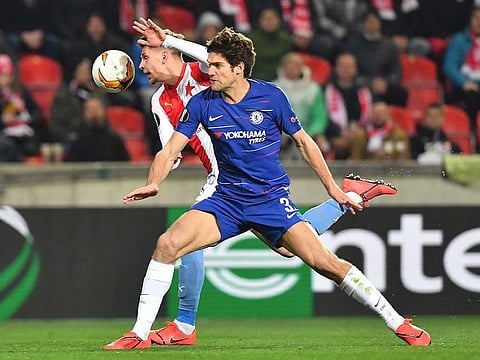 Slavia Prague's Czech midfielder Lukas Masopust and Chelsea's Spanish defender Marcos Alonso vie for the ball.