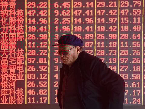 Stock information at a brokerage firm in Hangzhou, China. In China, the first in Asia to enter a bull market this year, the Shanghai index is poised to post its biggest weekly slump this year.