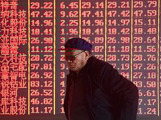 Asian shares skid as trade war deepens