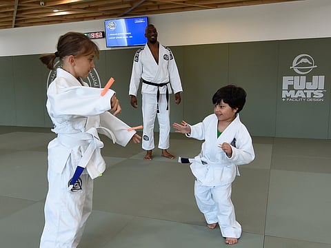 Amin Touati, Manager and Head Instructor, during the class training Cassandre Chevalier and Mohammed Al Ali, the youngest students of the academy at Royce Gracie Jiu Jitsu Academy in Dubai. 
