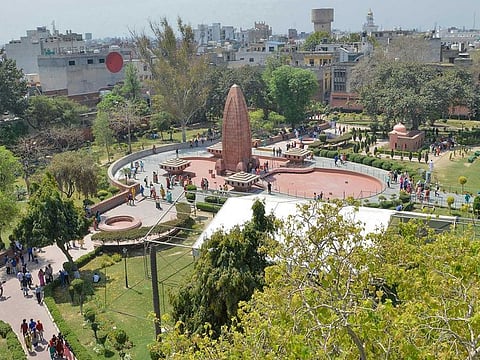 Indian visitors gather near the Jallianwala Bagh Martyrs' Memorial ahead of the 100th anniversary of the Jallianwala Bagh massacre in Amritsa.