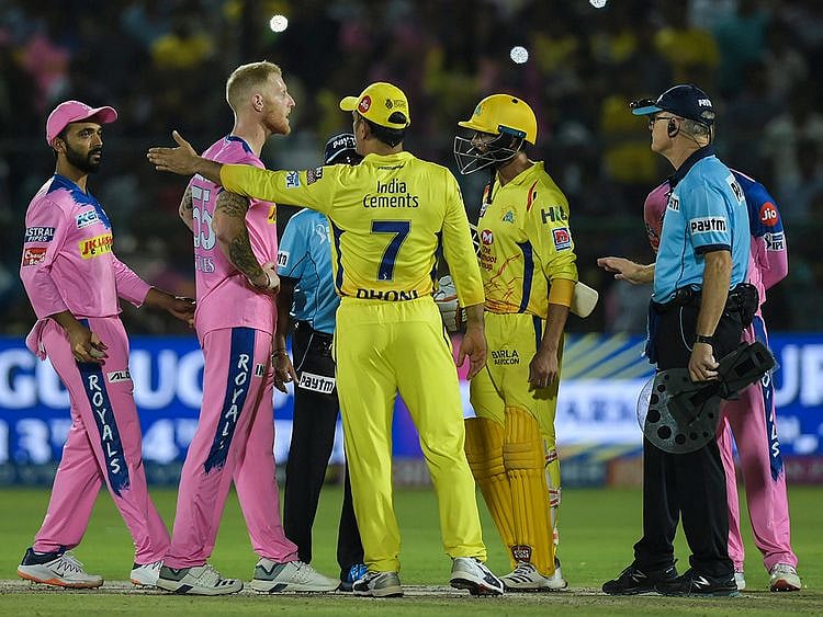 CSK captain M S Dhoni talks to the umpires