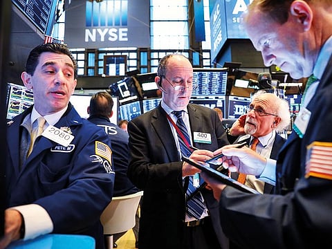 Traders at the New York Stock Exchange. The DJIA gained as much as 1.12 per cent to reach a high of 26,436.68, about 500 points away from its peak of 26,951.81.