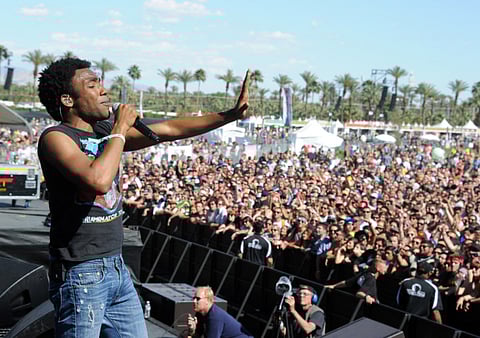 In this file photo, rapper/actor Donald Glover aka Childish Gambino performs onstage during the 2012 Coachella Valley Music & Arts Festival at the Empire Polo Field in Indio, California.   