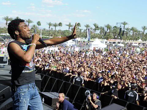 In this file photo, rapper/actor Donald Glover aka Childish Gambino performs onstage during the 2012 Coachella Valley Music & Arts Festival at the Empire Polo Field in Indio, California.   