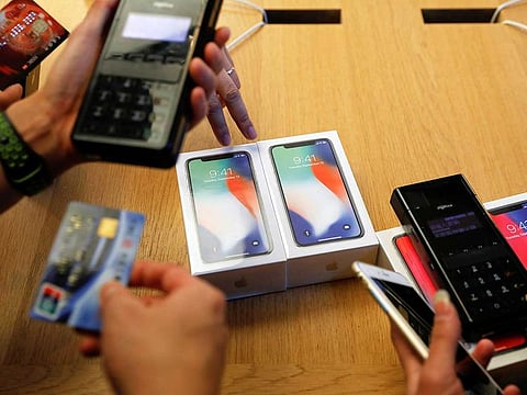 New iPhone X phones are purchased at an Apple Store in Beijing, China November 3, 2017. 