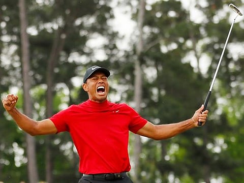 Tiger Woods celebrates on the 18th hole after winning the 2019 Masters. 