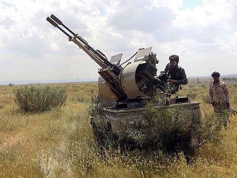 Fighters hold a position west of the city of Aziziah, some 60 kilometres southwest of the Libyan capital Tripoli