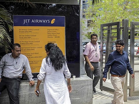 People exit the Jet Airways India Ltd. headquarters in Mumbai, India.