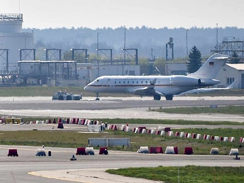 A Bombardier Global 5000 jet is being pulled over the tarmac by a truck. at the airport Schoenfeld near Berlin, Germany, Tuesday, April 16, 2019. 