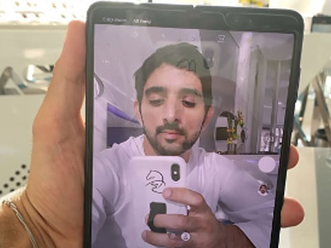 Shaikh Hamdan Bin Mohammad Bin Rashid Al Maktoum, Crown Prince of Dubai and Chairman of Dubai Executive Council, with a photo of the Samsung Galaxy Fold.