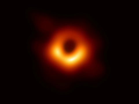 The first ever photo of a black hole, taken using a global network of telescopes, conducted by the Event Horizon Telescope (EHT) project, to gain insight into celestial objects with gravitational fields so strong that no matter or light can escape, is shown in this handout released April 10, 2019.