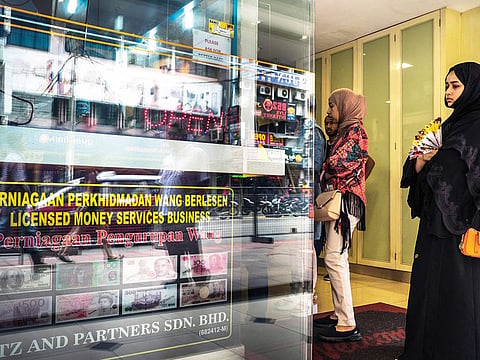 A currency exchange in Kuala Lumpur. The ringgit fell for a second day, and reached 4.1455 per dollar, its lowest level since January 25.