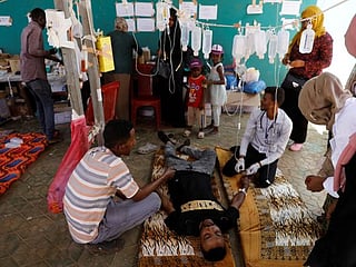 Volunteer doctors, cooks help Sudan keep up protests