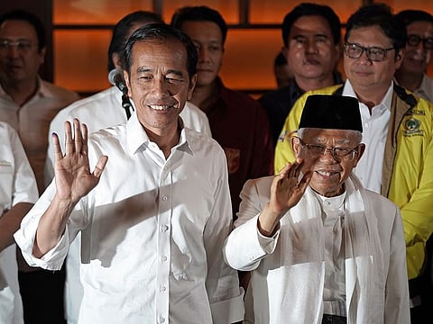 Joko Widodo, Indonesia's president, left, greets supporters at Djakarta Theatre in Jakarta, Indonesia.