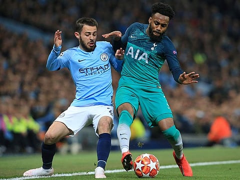 Manchester City's Portuguese midfielder Bernardo Silva (L) vies with Tottenham Hotspur's English defender Danny Rose during the UEFA Champions League quarter final second leg football match between Manchester City and Tottenham Hotspur at the Etihad Stadium in Manchester, north west England on April 17, 2019. 