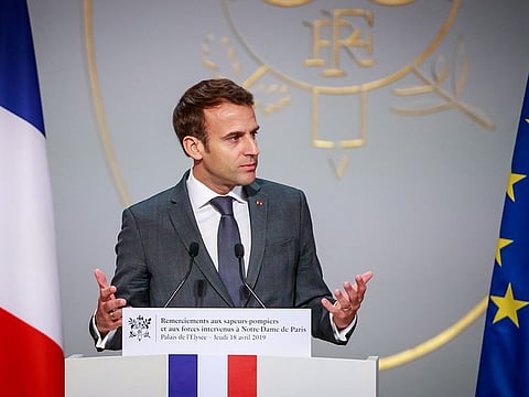 French President Emmanuel Macron delivers a speech for the Parisian Firefighters' brigade and security forces who took part at the fire extinguishing operations during the Notre Dame of Paris Cathedral fire, at Elysee Palace in Paris, France.