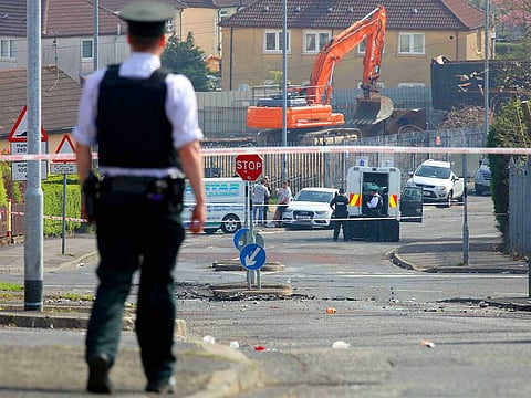 Police secure the area where a journalist was fatally shot amid rioting overnight in the Creggan area of Derry (Londonderry) in Northern Ireland on April 19, 2019.  