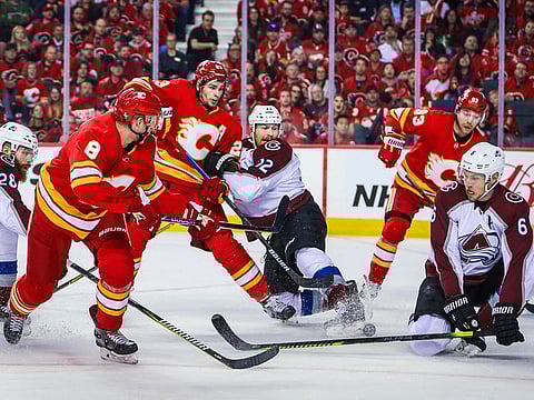 Colorado Avalanche defenseman Erik Johnson (6) blocks a shot by Calgary Flames defenseman Juuso Valimaki (8) during the first period in game five of the first round of the 2019 Stanley Cup Playoffs at Scotiabank Saddledome. 