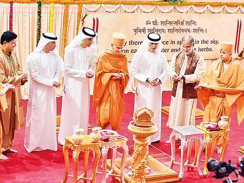 Mahant Swami Maharaj and other priests perform rituals in the presence of Thani Bin Ahmad Al Zeyoudi, Ahmad Bel Houl Al Falasi, Dr Mugheer Khamis Al Khaili, Navdeep Suri and Dr B.R. Shetty during the foundation stone-laying ceremoney for the temple in Abu Dhabi on Saturday.