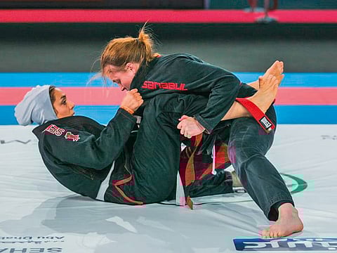 Mary Jones (above) in action against Fatemeh Doustdary during the semi-finals of the 70kg white belt category.