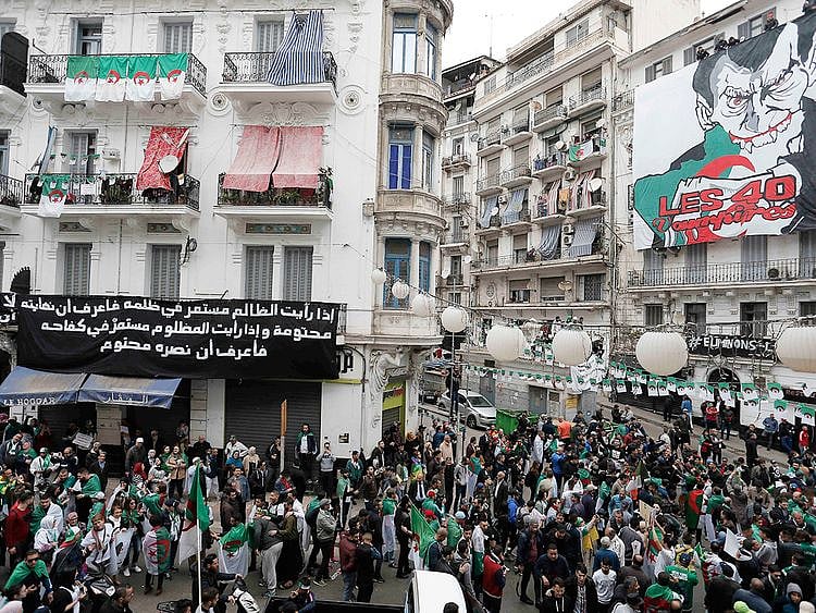 People chant slogans and carry banners