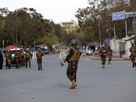 Afghan Security personnel arrive outside the Telecommunication Ministry during a gunfight with insurgents in Kabul, Afghanistan, Saturday, April 20, 2019. 