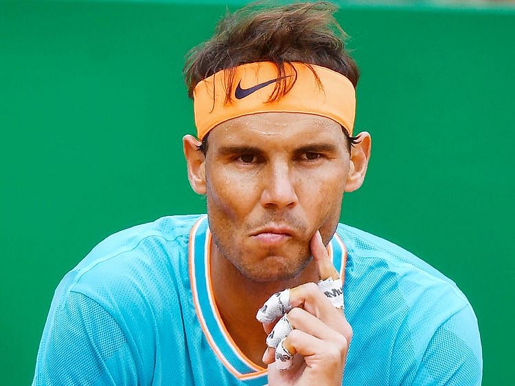 Rafael Nadal reacts