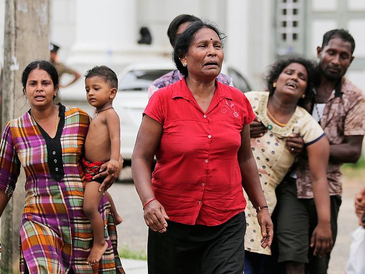 Relatives of a blast victim grieve