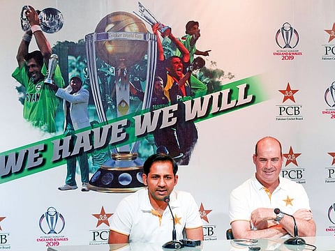 Pakistan captain Sarfraz Ahmad (left) speaks to media with coach Mickey Arthur during a press conference in Lahore. 