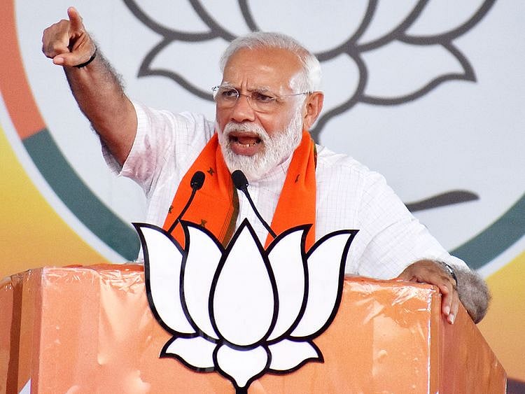 Prime Minister Narendra Modi addresses an election campaign rally in Bareilly
