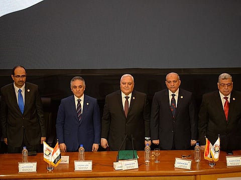 Members of Egypt's National Elections Commission (NEC) pose for a picture during a press conference in the Egyptian capital Cairo on April 23, 2019 to announce the result of the referendum extending the rule of President Abdul Fattah Al Sissi.